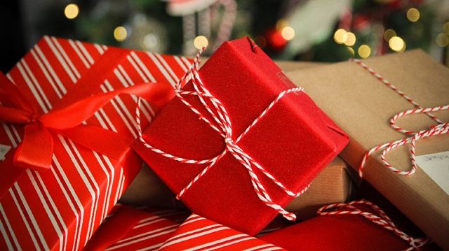 pile of red christmas gifts